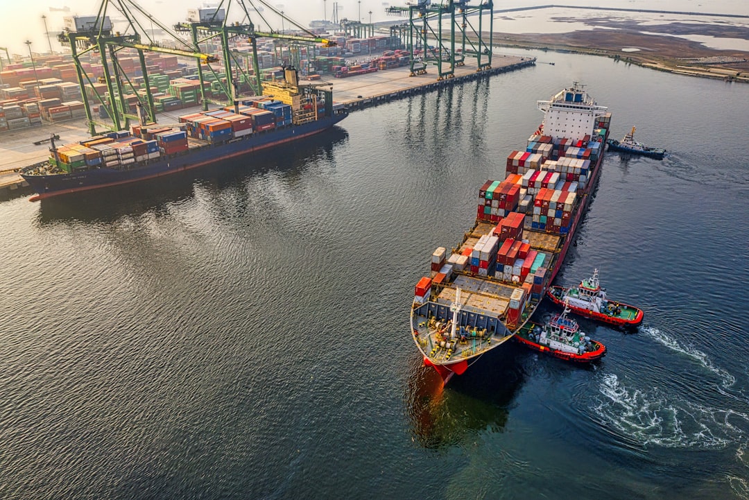 Container ship leaving an international logistics port